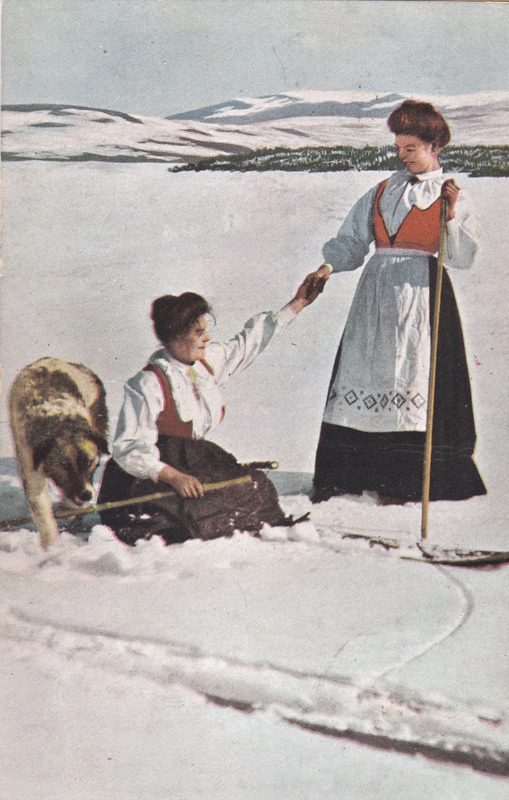 Damer i bunad på ski ( Abel 918)